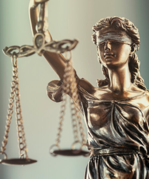 Legal and law concept statue of Lady Justice on blurred background